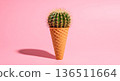 Surreal cactus in an ice cream cone on a pink background with shadow 136511664
