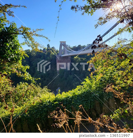 This is Clifton Suspension Bridge with hot ballon in summer time 136511997