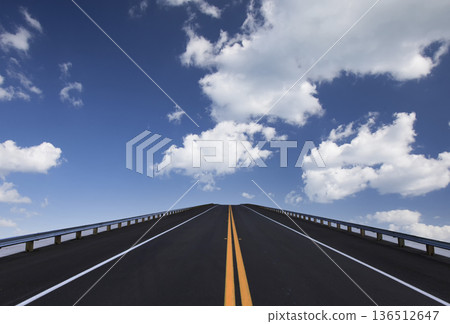 Road lines, clouds and sky in florida Road lines, clouds and sky in florida 136512647