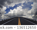 Road lines, clouds and sky in florida 136512650
