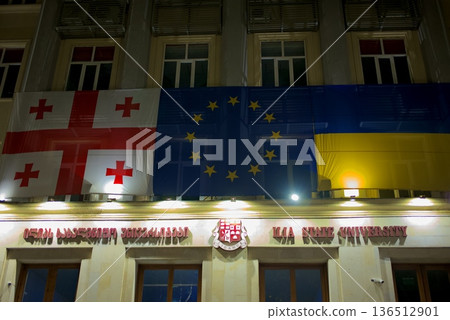 Ilia State University ISU building decorated with Georgian, EU and Ukrainian flags in Tbilisi, Georgia 136512901
