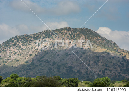 Rocky Mountain Hillside Under Blue Sky in rural Rajasthan, India Rocky Mountain Hillside Under Blue Sky in rural Rajasthan, India 136512993