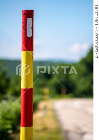 Red and Yellow Striped Roadside Post Red and Yellow Striped Roadside Post 136513391