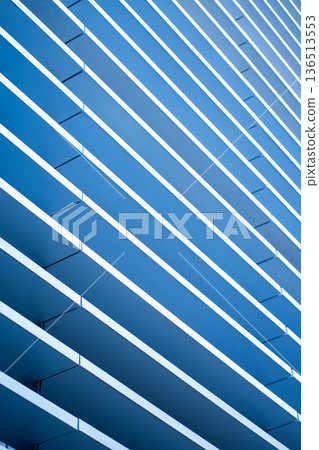 Abstract blue futuristic architecture creating a rhythmic geometric pattern with parallel lines and stripes, symbolizing modern design, technology, and connection Abstract blue futuristic architecture creating a rhythmic geometric pattern with parallel lines and stripes, symbolizing modern design, technology, and connection 136513553