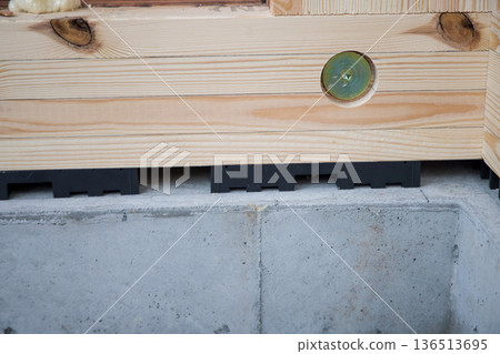 Housing image: Foundation ventilation of a wooden house under construction, all-around ventilation Housing image: Foundation ventilation of a wooden house under construction, all-around ventilation 136513695