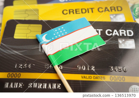 Uzbekistan flag on credit card, finance economy trading shopping online business. Uzbekistan flag on credit card, finance economy trading shopping online business. 136513970