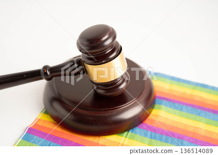 Gavel for judge lawyer on rainbow flag, symbol of LGBT pride month. Gavel for judge lawyer on rainbow flag, symbol of LGBT pride month. 136514089