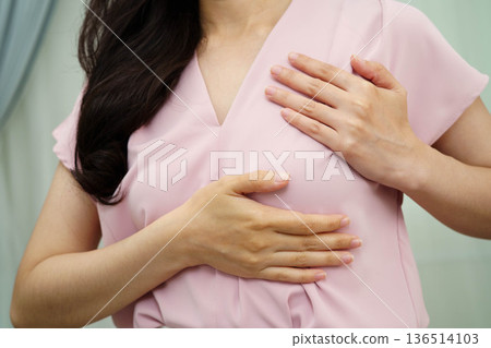 Asian woman self touching check lump or Breast cancer, Breast Self Exam. Asian woman self touching check lump or Breast cancer, Breast Self Exam. 136514103