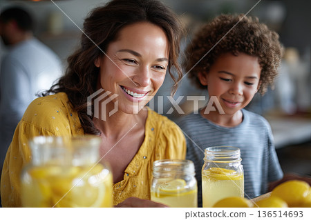 family preparing homemade lemonade in bright kitchen 136514693