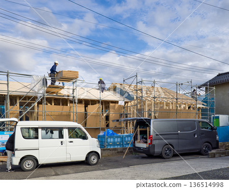 Image of a house: A wooden one-story house under construction with roof sheathing Image of a house: A wooden one-story house under construction with roof sheathing 136514998