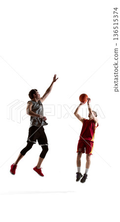Basketball players jumping during contested shot isolated on white background. Basketball players jumping during contested shot isolated on white background. 136515374