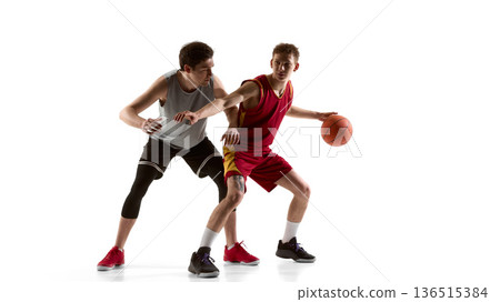 Basketball players in defensive stance during one on one match isolated on white Basketball players in defensive stance during one on one match isolated on white 136515384