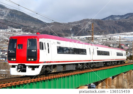 Nagano Electric Railway 2100 series train heading towards Nagano on the bridge section Nagano Electric Railway 2100 series train heading towards Nagano on the bridge section 136515459