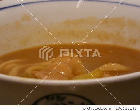 Close-up of curry udon noodles in rich soup Close-up of curry udon noodles in rich soup 136516185