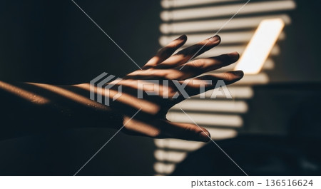 Sunlight Rays Through Blinds Casting Shadows on Dark Wall Sunlight Rays Through Blinds Casting Shadows on Dark Wall 136516624
