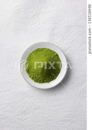 White washi paper background and vibrant green matcha powder 136516696