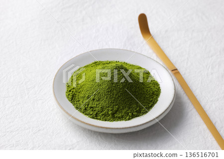 White washi paper background and vibrant green matcha powder 136516701