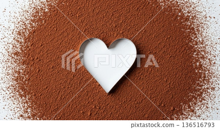 Heart shape in cocoa powder on white background top view. Heart shape in cocoa powder on white background top view. 136516793