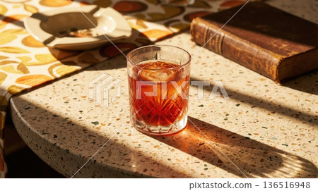 Refreshing Negroni Cocktail Held Over Mediterranean Sea View Refreshing Negroni Cocktail Held Over Mediterranean Sea View 136516948