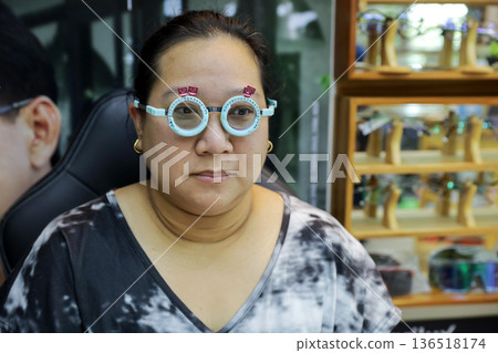Phoropter for eye test, lenses glasses for eye check in optical store. 136518174