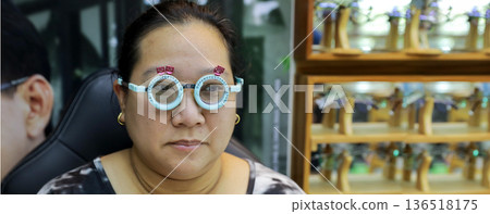 Phoropter for eye test, lenses glasses for eye check in optical store. 136518175