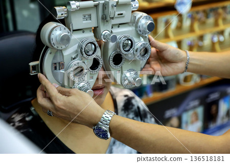 Phoropter for eye test, lenses glasses for eye check in optical store. 136518181