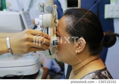 Phoropter for eye test, lenses glasses for eye check in optical store. Phoropter for eye test, lenses glasses for eye check in optical store. 136518182