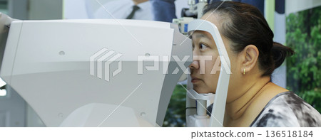 Phoropter for eye test, lenses glasses for eye check in optical store. 136518184