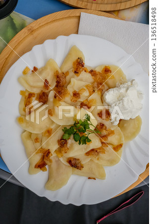 Top View Ukrainian Vareniki with Fried Onions on Plate 136518498