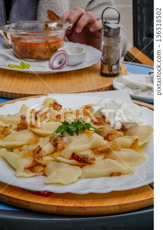 Side View Ukrainian Vareniki with Fried Onions and Borscht 136518502