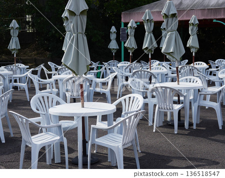 Tables and chairs in a park rest area on a winter morning 136518547