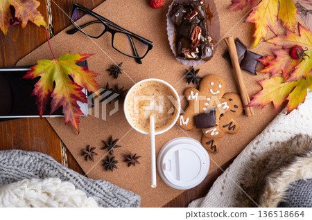 autumn cozy and warm composition with coffee at wooden table with leaves. life style concept. flat lay autumn cozy and warm composition with coffee at wooden table with leaves. life style concept. flat lay 136518664