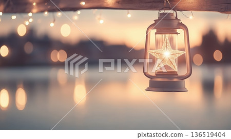 Star lantern glowing at sunset over water with bokeh lights 136519404