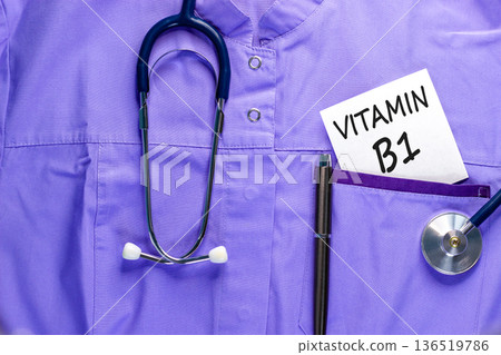 Vitamin B1 symbol. Concept words Vitamin B1 on beautiful white card. Stethoscope and pen. Beautiful medical uniform. Medical healthy lifestyle Vitamin B1 concept. Vitamin B1 symbol. Concept words Vitamin B1 on beautiful white card. Stethoscope and pen. Beautiful medical uniform. Medical healthy lifestyle Vitamin B1 concept. 136519786