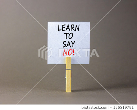 Learn to say no symbol. Concept words phrase Learn to say no on beautiful white paper on wooden clothespin. Beautiful grey paper background. Business psychological Learn to say no concept Copy space Learn to say no symbol. Concept words phrase Learn to say no on beautiful white paper on wooden clothespin. Beautiful grey paper background. Business psychological Learn to say no concept Copy space 136519791