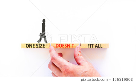 One size does not fit all symbol. Concept words One size does not fit all on beautiful wooden blocks. Beautiful white background. Business one size does not fit all concept. Copy space. One size does not fit all symbol. Concept words One size does not fit all on beautiful wooden blocks. Beautiful white background. Business one size does not fit all concept. Copy space. 136519808
