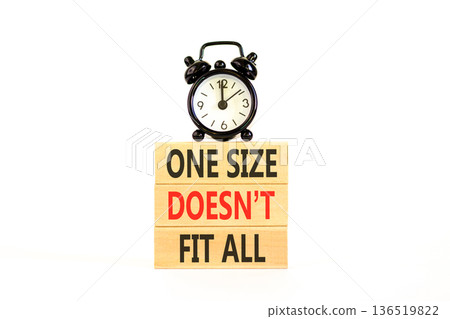 One size does not fit all symbol. Concept words One size does not fit all on beautiful wooden blocks. Beautiful white background. Alarm clock. Business one size does not fit all concept. Copy space. 136519822