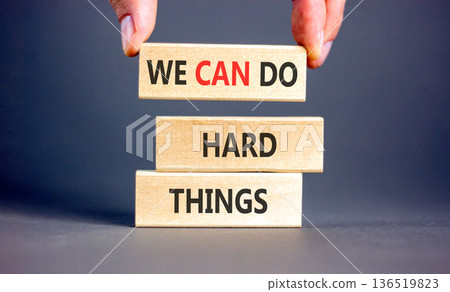 Support, help we can do hard things symbol. Concept words We can do hard things on beautiful wooden blocks. Beautiful grey background. Business we can do hard things concept. Copy space. 136519823