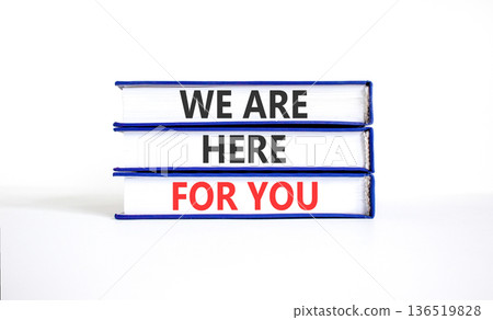 Support, help and we are here for you symbol. Concept words We are here for you on beautiful books. Beautiful white paper background. Business we are here for you concept. Copy space. 136519828