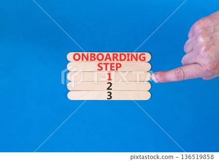 Time to step 1 onboarding symbol. Concept words Onboarding step 1 on beautiful wooden block. Businessman's hand. Beautiful blue background. Business success step 1 onboarding concept. Copy space. Time to step 1 onboarding symbol. Concept words Onboarding step 1 on beautiful wooden block. Businessman's hand. Beautiful blue background. Business success step 1 onboarding concept. Copy space. 136519858
