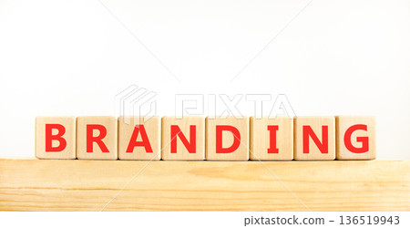 Branding brand word symbol. Concept word Branding on beautiful wooden blocks on wooden beam. Beautiful white background. Business support help branding brand word concept. Copy space. 136519943