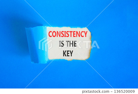 Consistency is the key symbol. Concept words Consistency is the key on beautiful white paper. Beautiful blue paper background. Business consistency is the key concept. Copy space. Consistency is the key symbol. Concept words Consistency is the key on beautiful white paper. Beautiful blue paper background. Business consistency is the key concept. Copy space. 136520009