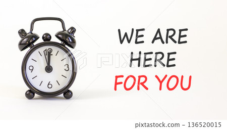 Support, help and we are here for you symbol. Concept words We are here for you on beautiful white paper. Beautiful white background. Alarm clock. Business we are here for you concept. Copy space. 136520015