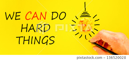 Support, help we can do hard things symbol. Concept words We can do hard things on beautiful paper. Beautiful yellow background. Businessman's hand. Business we can do hard things concept. Copy space. Support, help we can do hard things symbol. Concept words We can do hard things on beautiful paper. Beautiful yellow background. Businessman's hand. Business we can do hard things concept. Copy space. 136520028