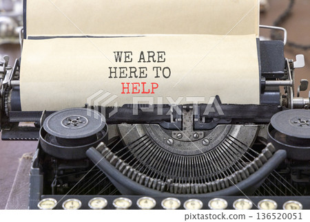 Support, help and we are here to help symbol. Concept words We are here to help typed on beautiful old retro typewriter. Beautiful white background. Business we are here to help concept. Copy space. 136520051