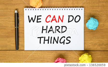 Support, help we can do hard things symbol. Concept words We can do hard things on beautiful white note. Beautiful wooden background. Black pen. Business we can do hard things concept. Copy space. 136520059