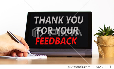 Thank you for your feedback symbol. Concept words Thank you for your feedback on black tablet. Beautiful white background. Businessman's hand. Business thank you for your feedback concept. Copy space. 136520091