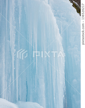 Beautiful frozen waterfall scenery in mid-winter tourist spot Beautiful frozen waterfall scenery in mid-winter tourist spot 136520217
