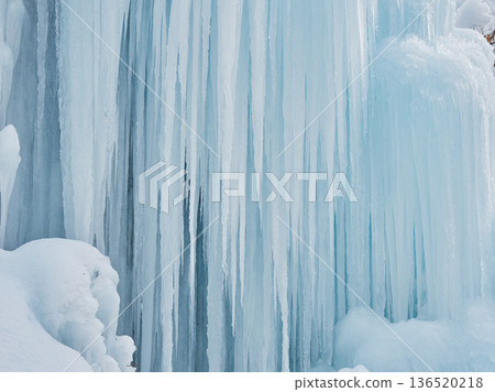 Beautiful frozen waterfall scenery in mid-winter tourist spot Beautiful frozen waterfall scenery in mid-winter tourist spot 136520218