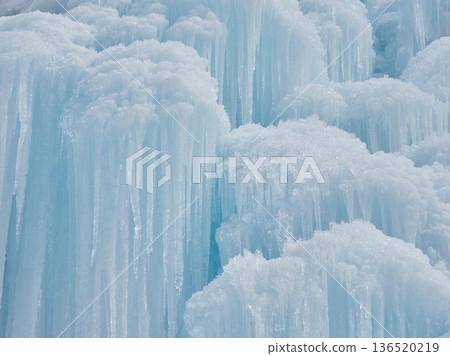 Beautiful frozen waterfall scenery in mid-winter tourist spot Beautiful frozen waterfall scenery in mid-winter tourist spot 136520219